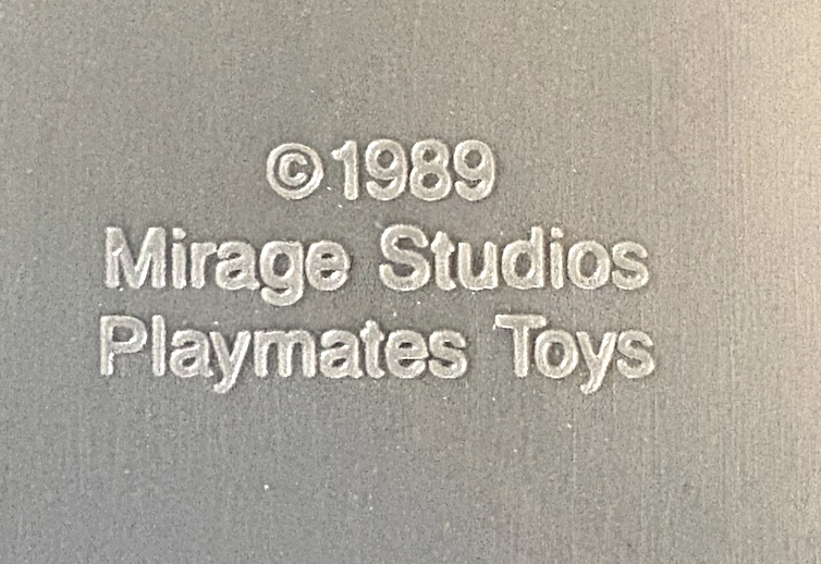 The moulded copyright stamp on the underside of the Sewer Playset, reading copyright 1989 Mirage Studios Playmates Toys